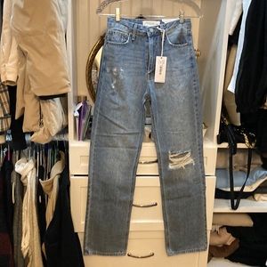 High  rise long straight leg. Rips on the Left knee